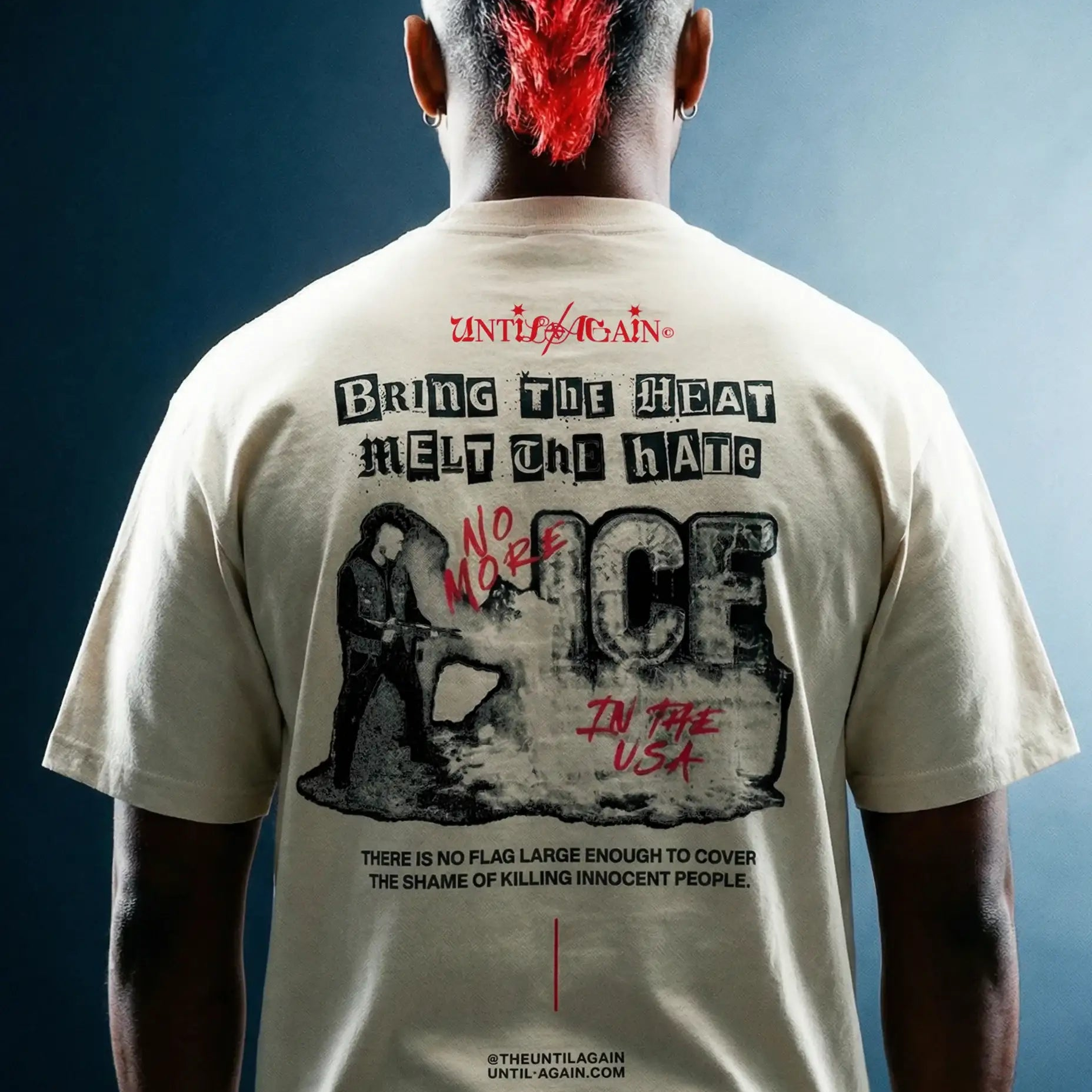 Man with mohawk wearing graphic streetwear t-shirt featuring bold anti-ICE slogan and protest art